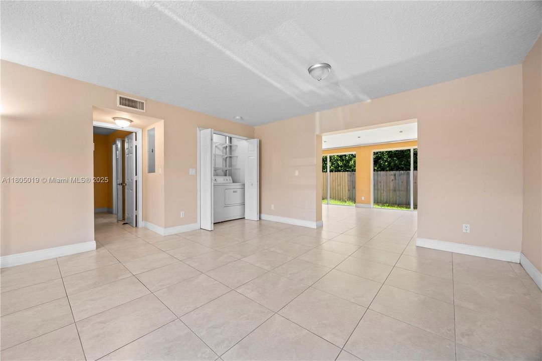 Living/Dining area and laundry closet.