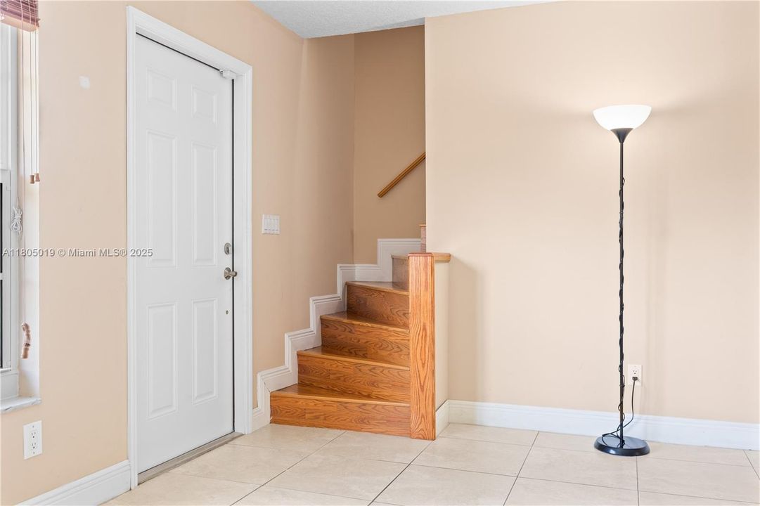 Front door and second floor stairway.
