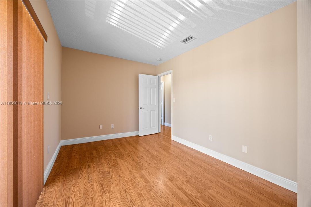 Top floor Master bedroom with a long balcony.