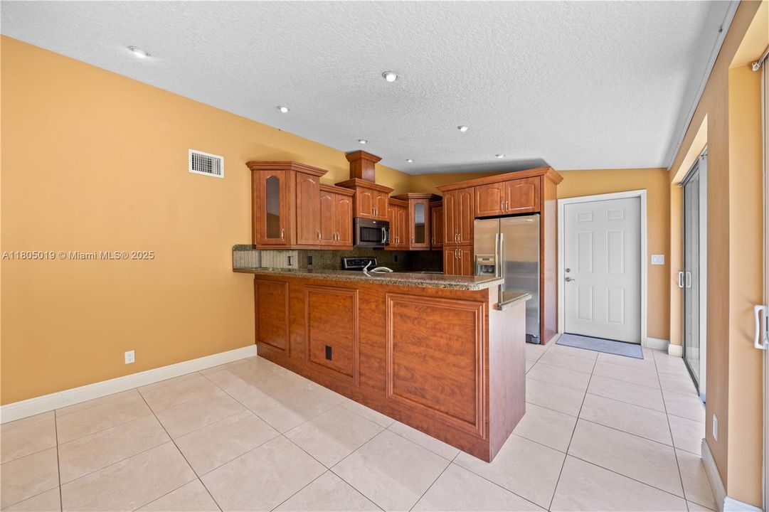 View of the family room and the kitchen.
