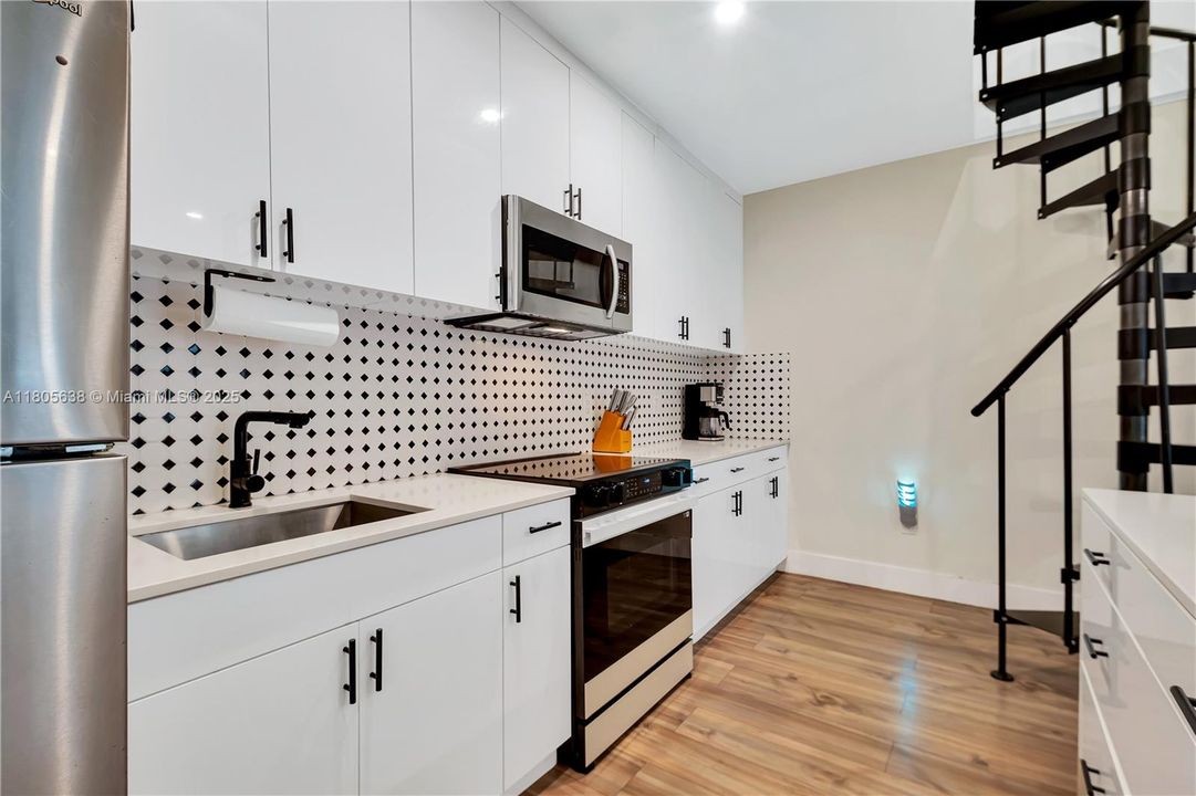 UNIT 2 KITCHEN/ STAIRS TO LOFT