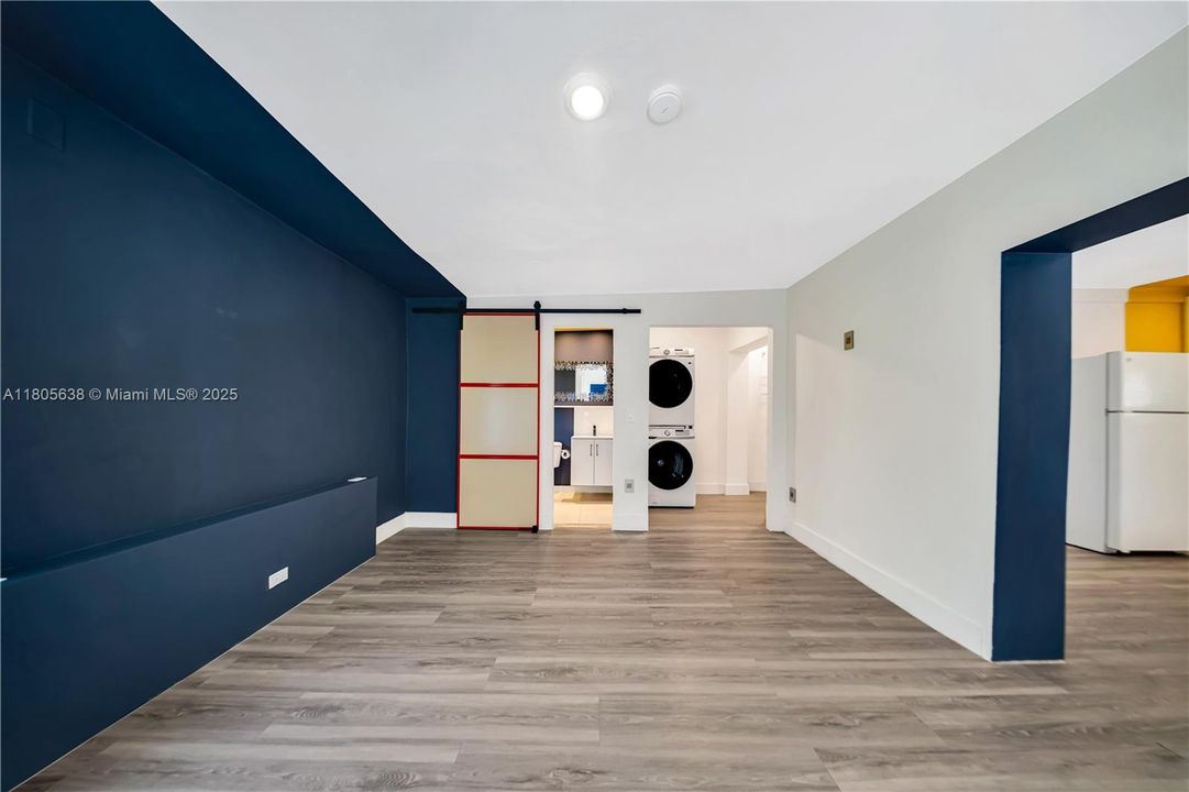 UNIT 5 BEDROOM AND VIEW OF BATHROOM/ LAUNDRY + CLOSET