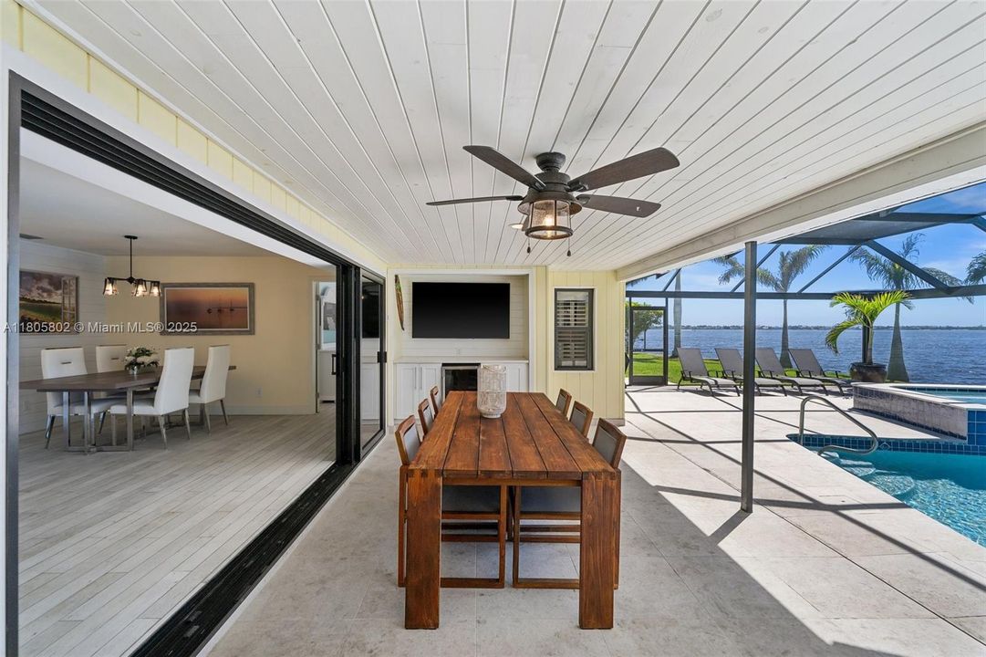 Covered Lanai with bar, refrigerator and TV