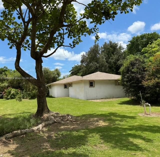 Side of home w/ pictures of new roof.