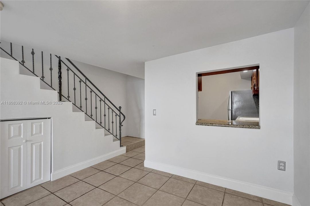 Notice the convenient pass-through window from kithen to the dining room.