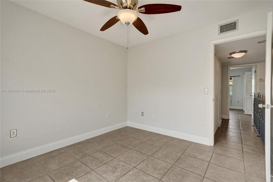 Bedroom #2 of 2 features easy access to the large 2nd floor bathroom and separate dressing area.