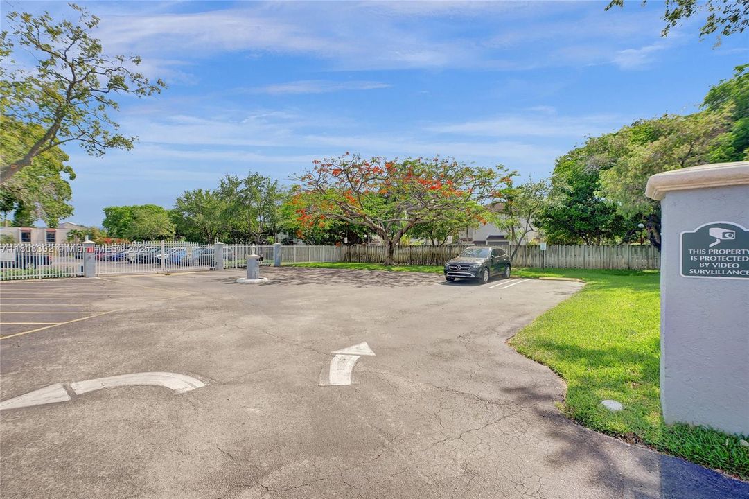 Parking lot 2 has even more parking outside of the security gates and pedestrian gate!  Notice the security cameras throughout. "An ounce of prevention is worth a pound of cure"!