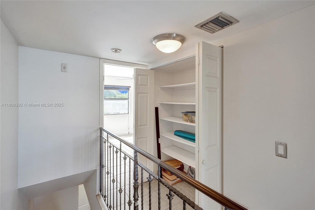 2nd floor landing boasts a huge utility closet. Can never have too many closets.