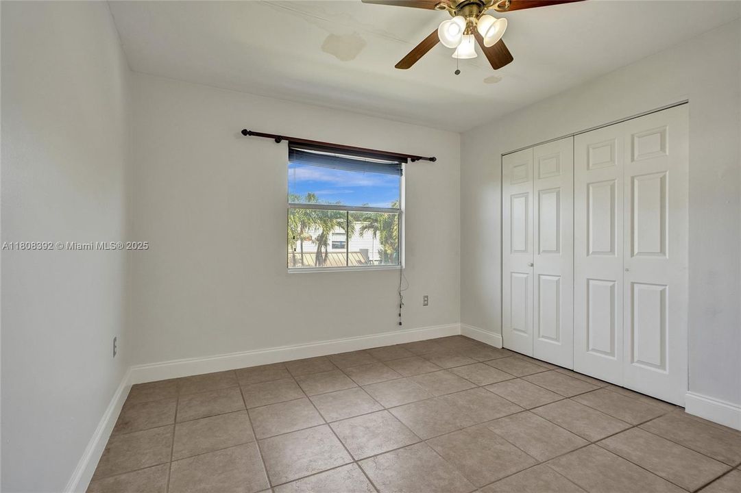 Notice how large, light and bright this freshly painted bedroom #1 is.