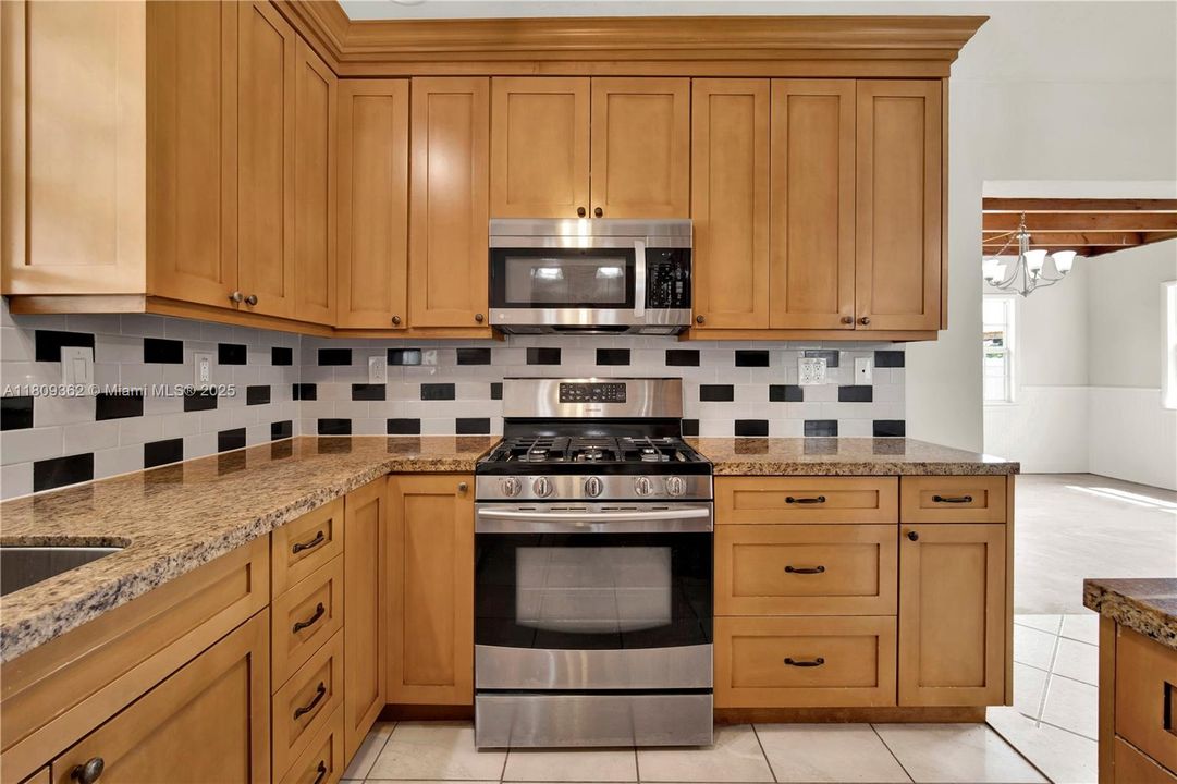 A view from within the kitchen toward the laundry room