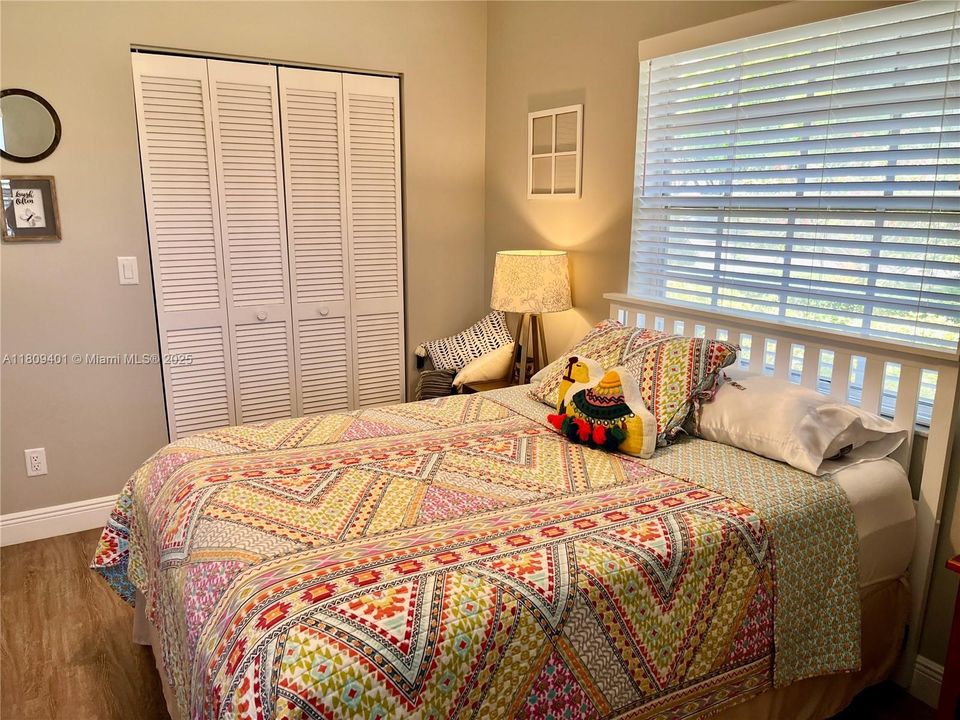 Guest bedroom with walk-in closet