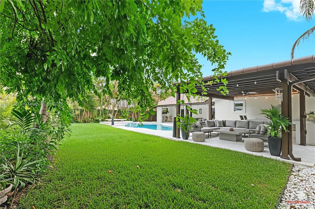 Outdoor kitchen and yard staged