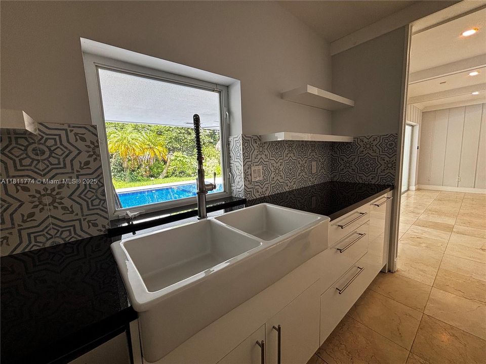 watch the pool while in the kitchen