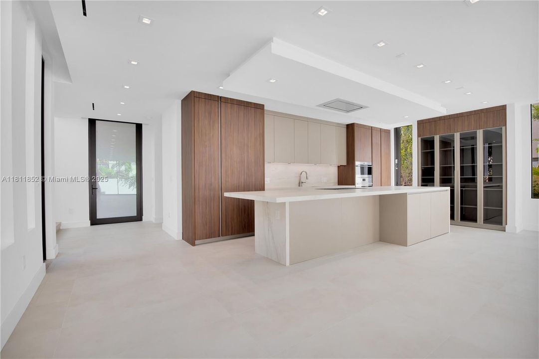 Entrance door and kitchen view from the living room.