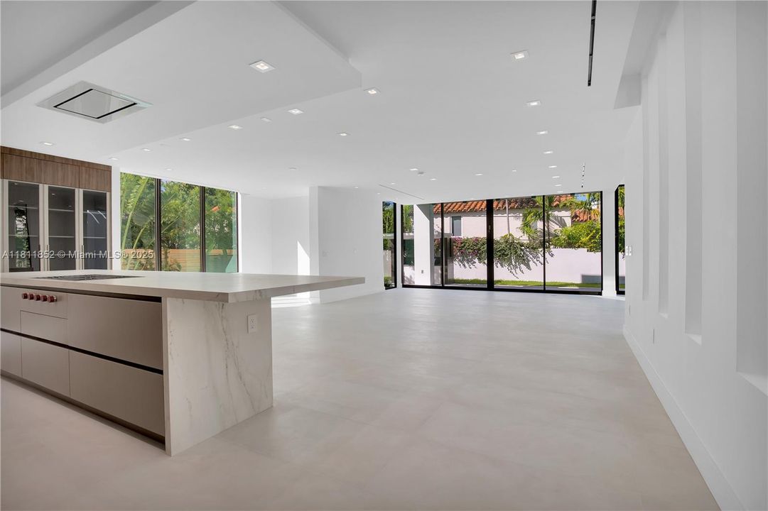 kitchen and backyard sliding view as one enters the main floor.