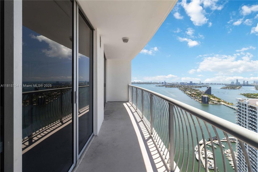 Expansive private balcony with panoramic ocean and city views — perfect for morning coffee or evening relaxation in Downtown Miami.