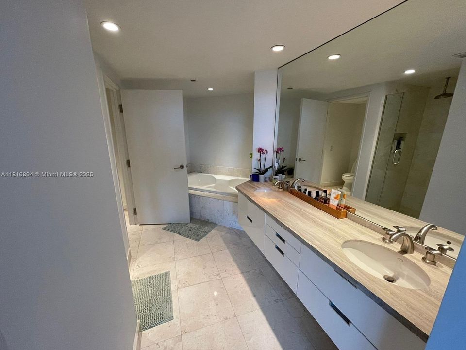 Spacious bath with separate tub and shower