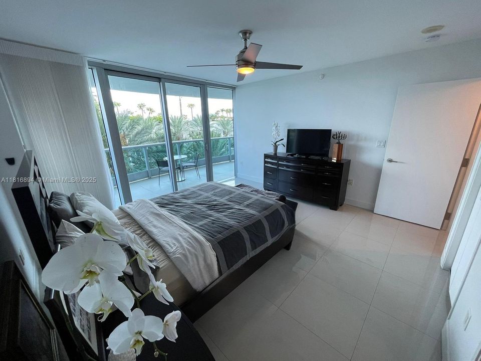 Floor to ceiling glass doors to ample terrace