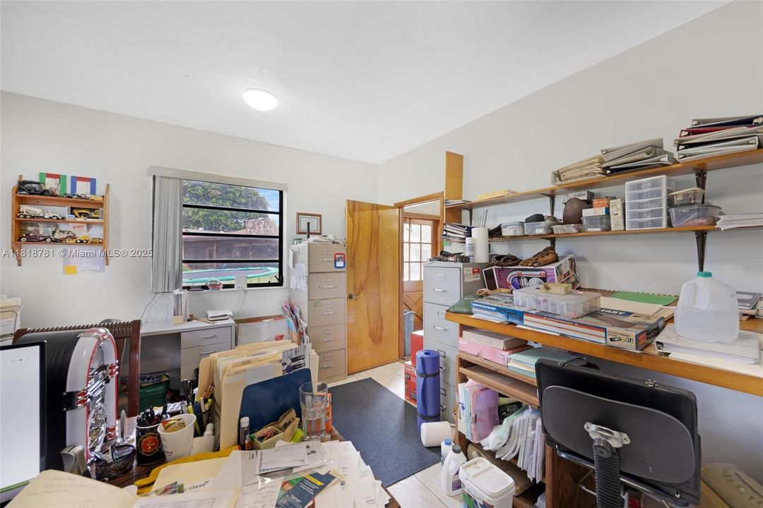 3 separate car door on garage/workshop and a/c office