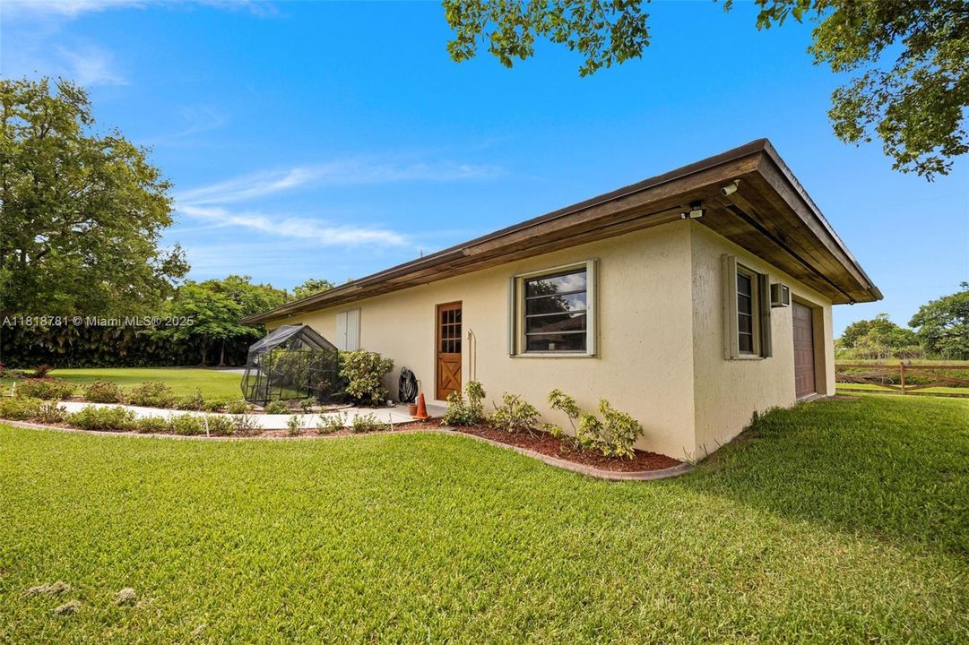 Entrance to 3 car garage, office workshop