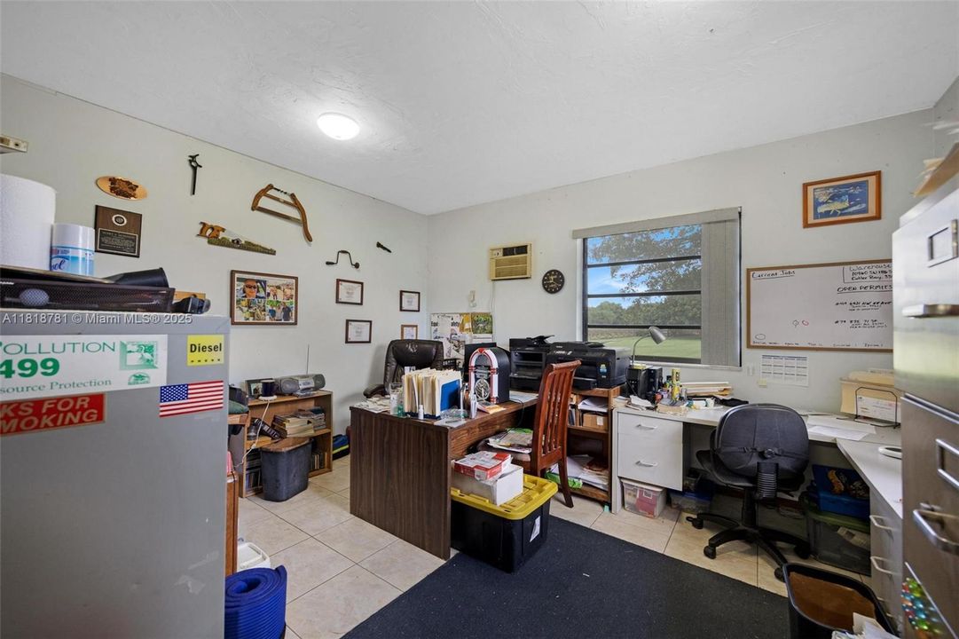 3 separate car door on garage/workshop and a/c office