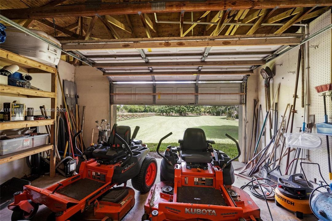 3 separate car door on garage/workshop and a/c office