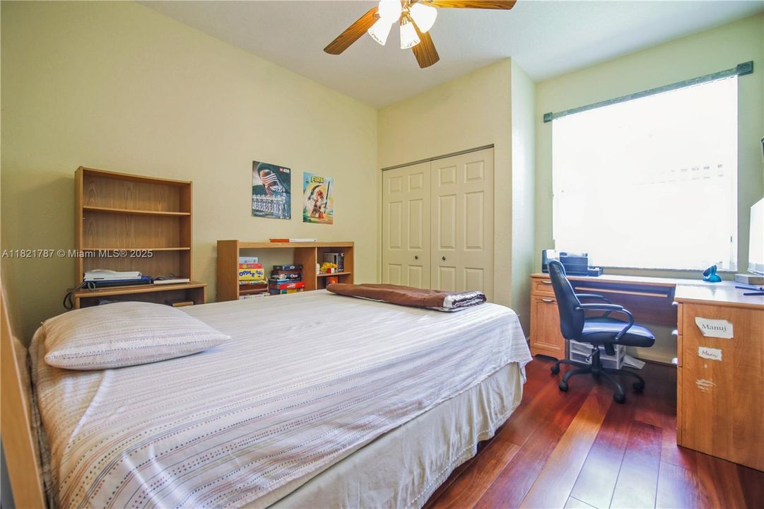 Great size bedroom with beautiful wood floors & custom blinds on window.