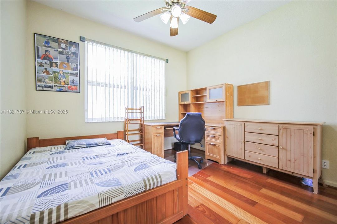 Great size bedroom with beautiful wood floors & custom blinds on window.