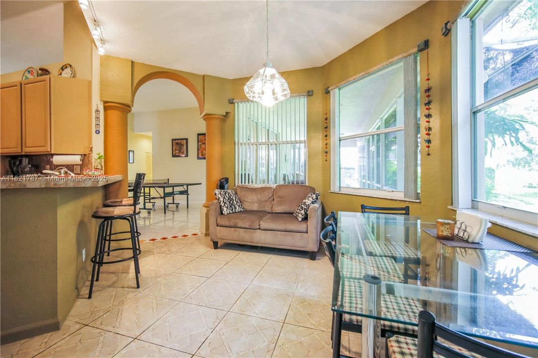 Great eat-in kitchen area with space for both counter top & table seating as well. Access to living room on one side & family room on the other.