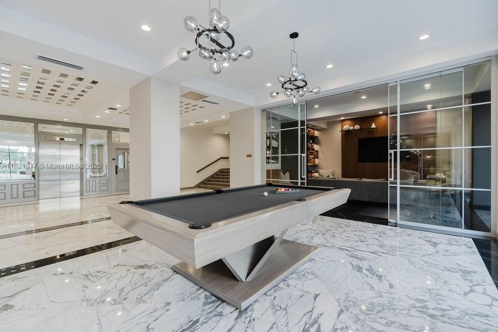 Resident game room with lounge seating — ideal for relaxation and social gatherings.