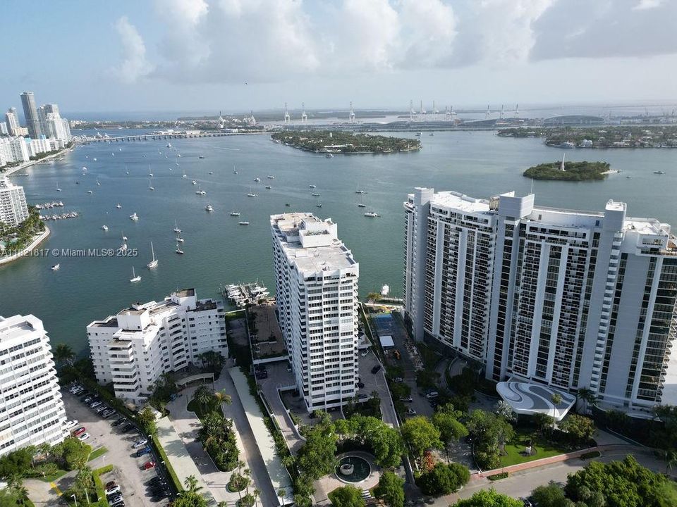 Aerial view of 11 Island Avenue building surrounded by Biscayne Bay — premium location near Sunset Harbour and Lincoln Road.
