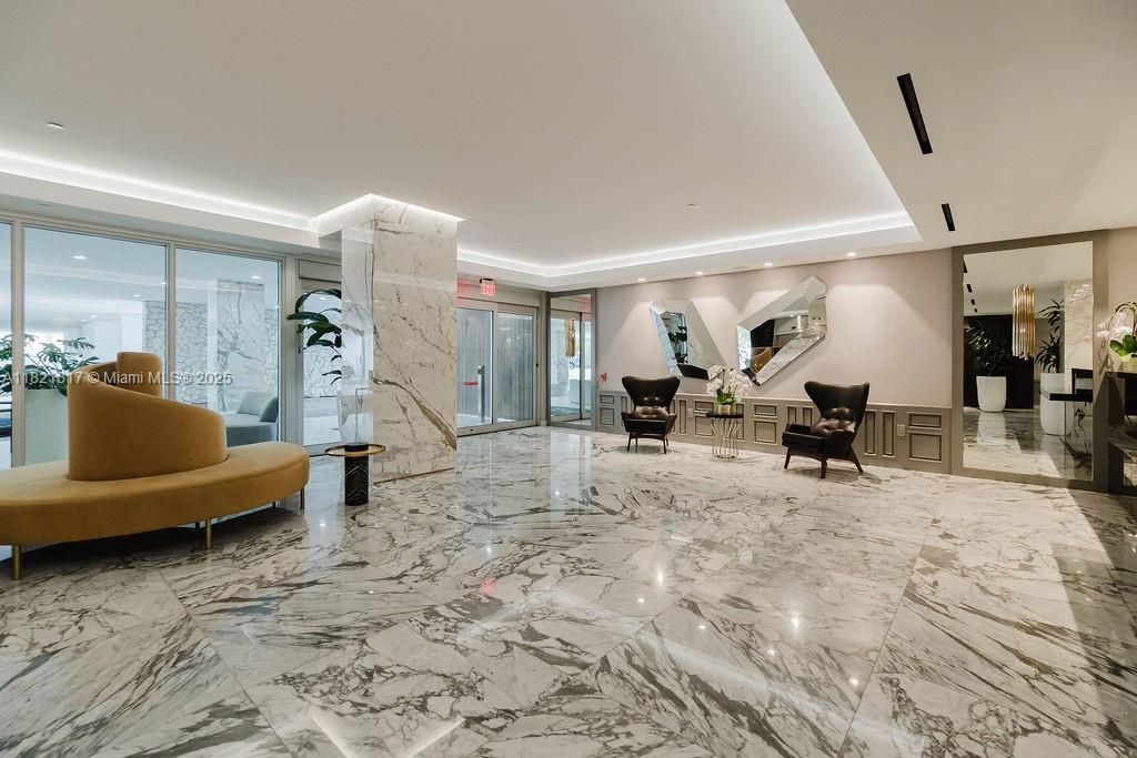 Luxurious lobby area showcasing bright interiors and contemporary finishes — resort-style Miami Beach condo entrance.