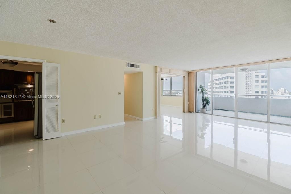 Bright dining area with large windows and modern finishes — perfect for entertaining with scenic Miami Beach views.