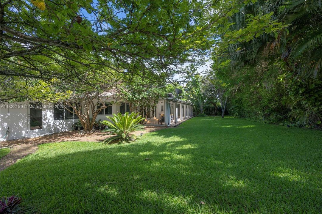 Very spacious backyard w/ huge roffed patio