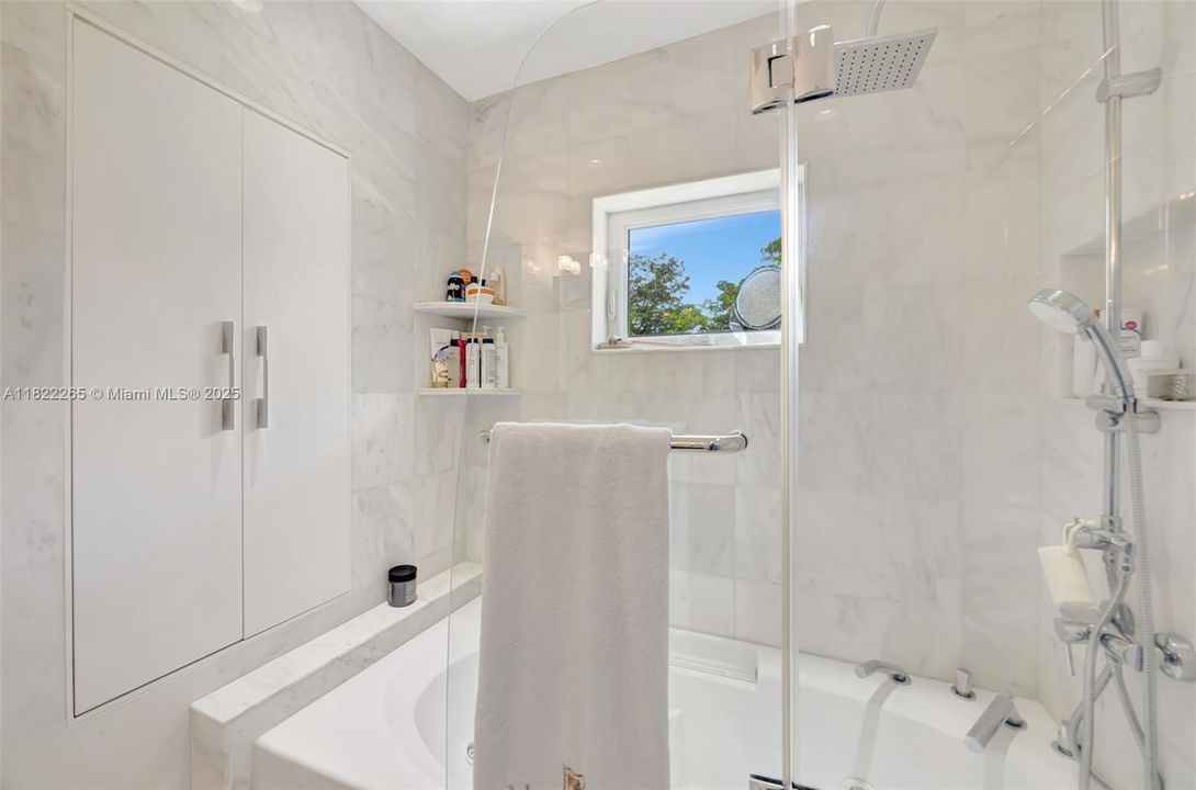 Marble Tiled from floor to ceiling