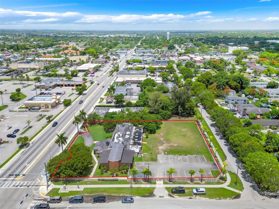 VIEW OF CAMPBELL DRIVE IN HEART OF HOMESTEAD. 1 OWNER   BETWEEN US1 AND KROME AVE//FACES SOUTH ACROSS FROM SHOPPING CENTER, VIEW IS LOOKING WEST TOWARDS KROME loo