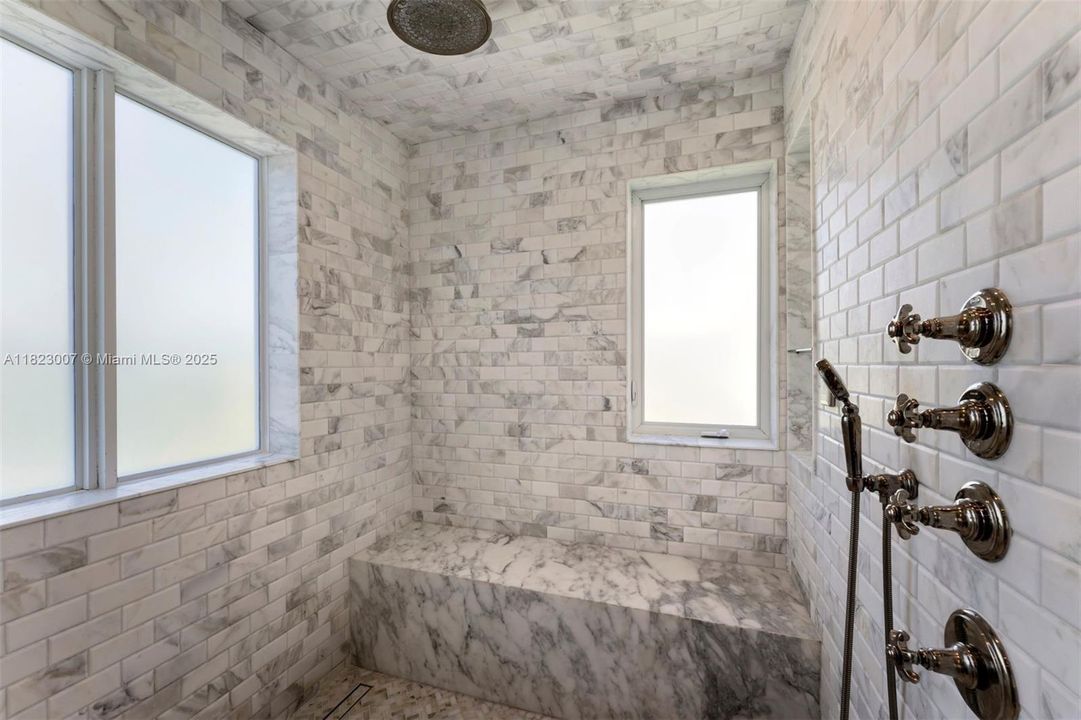 Spacious marble shower.