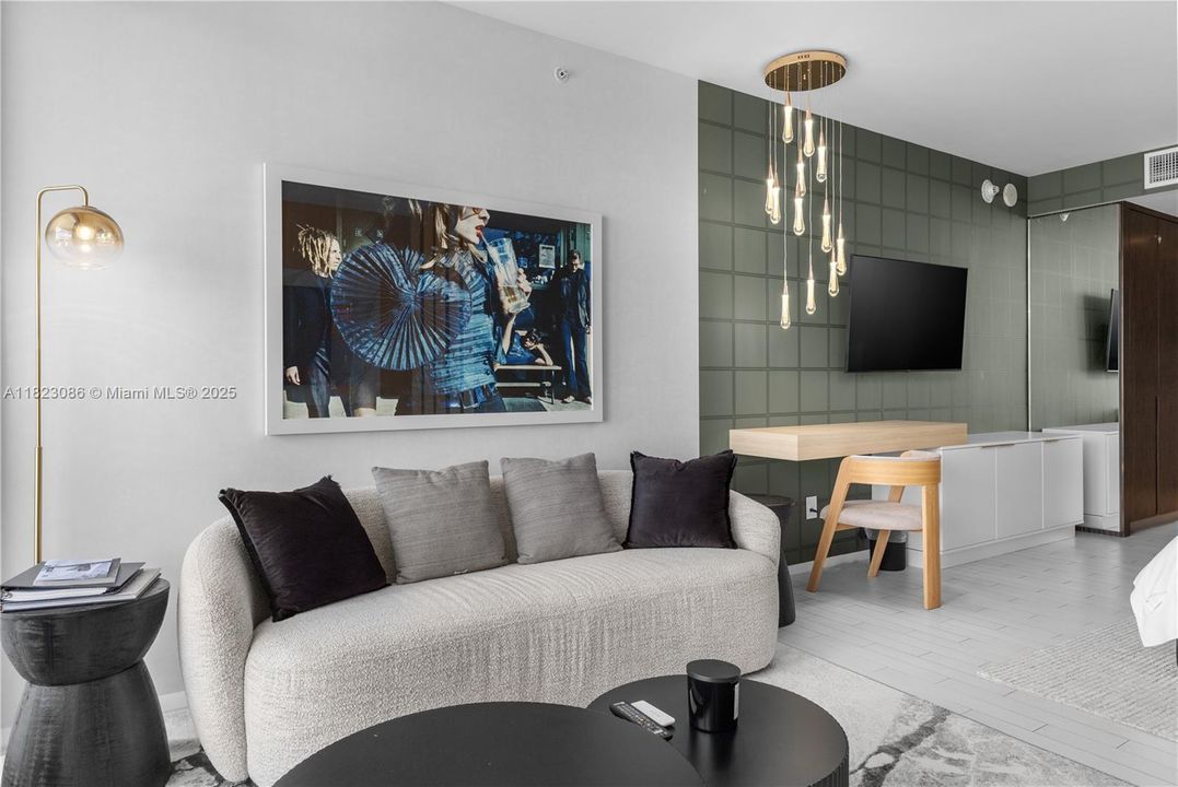 Couch with painting and lighting.