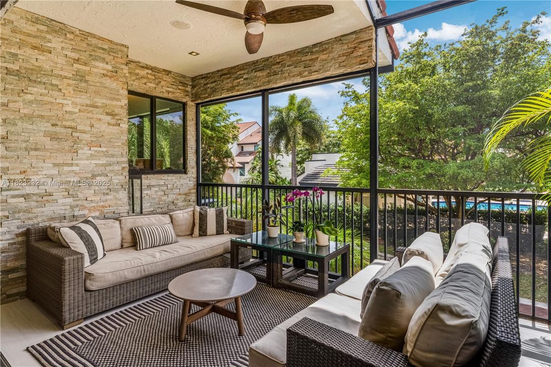 Stunning patio with serene views of the pool, perfect for relaxing and entertaining