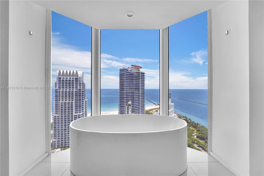 Soaking or cold plunge tub in master bathroom spa area with amazing views.  Relax here w the lights off at night for a majestic spa-like experience!