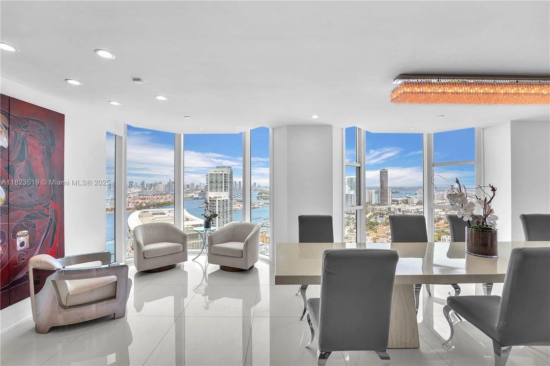 This is the transition from dining room to small sitting area w TV and speakers. More Beautiful western views along entire length!