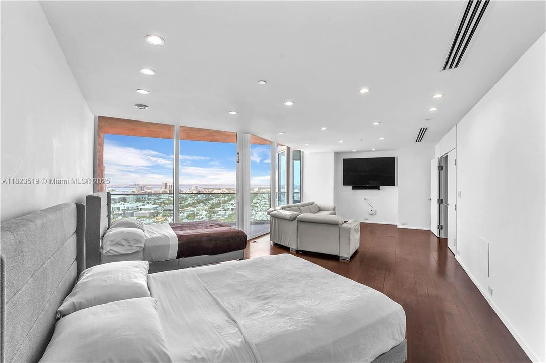 Second Dual Master bedroom with view facing West.  Has its own sofa area with plasma TV.  Balcony #4 shown.