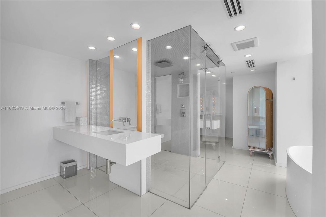 Master Bathroom.  Dual sinks.  Hot pressurized Steam shower w rainfall spout and two normal shower heads.