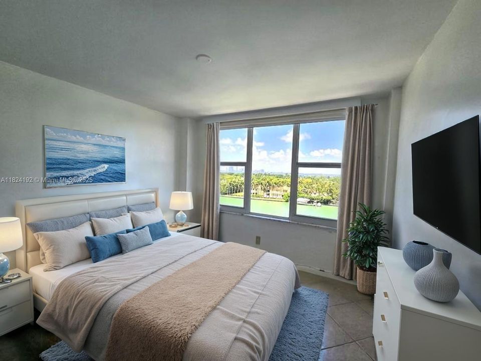 Furniture staged. Bright and spacious guest bedroom with large impact windows showcasing water views and the city skyline. Natural light fills the room, creating an open and airy feel.
