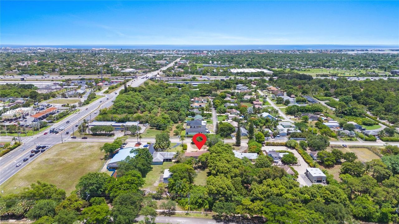 Huge 0.72 acre lot with endless opportunities near the beach and highway- this is view of property looking east