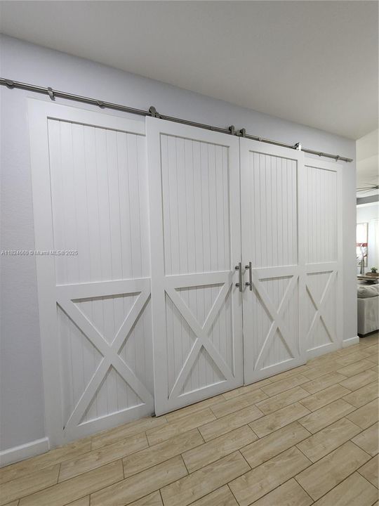 Entrance to family room,TV with Murphy beds