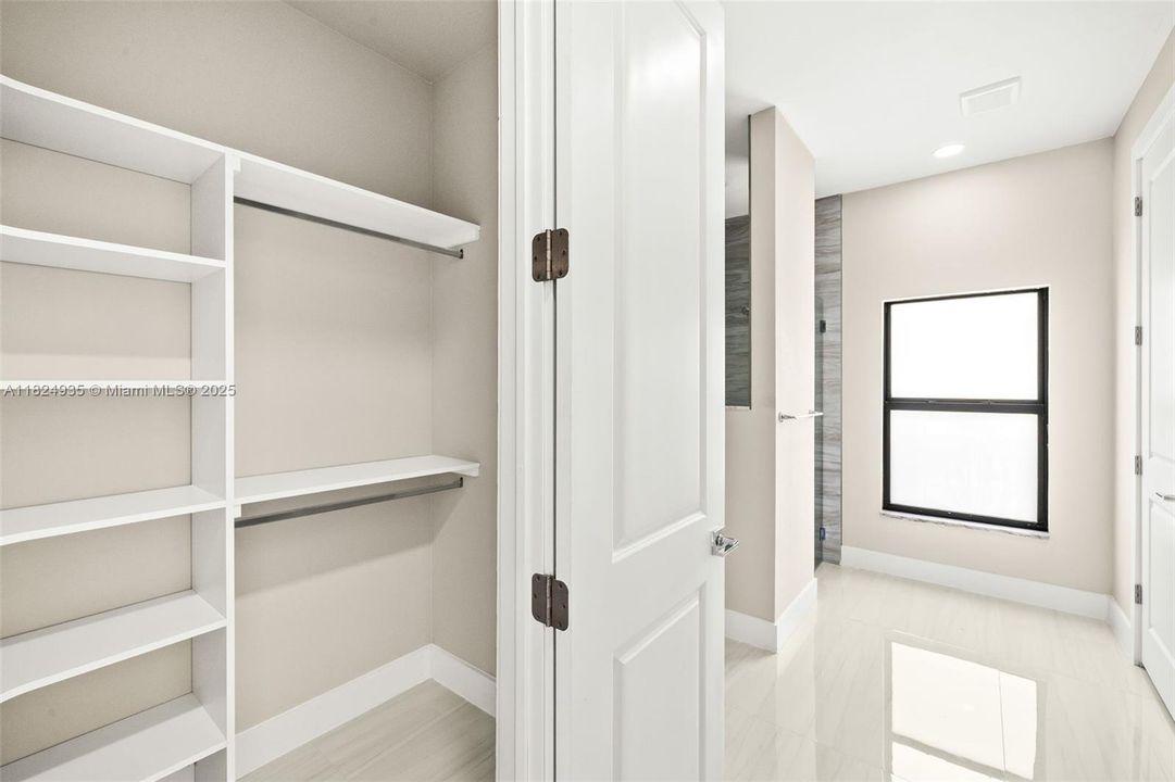 Second Primary Walk-In Closet with Built-In Shelving