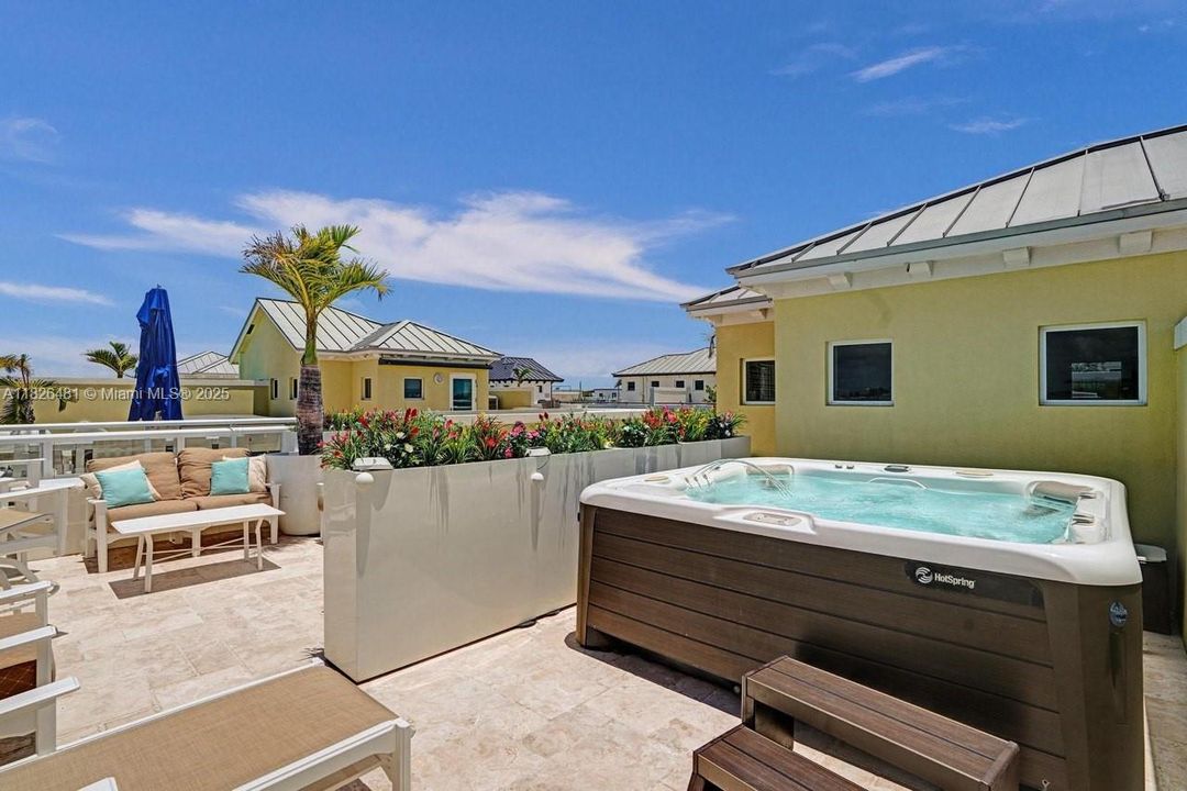 ROOF PATIO WITH SALT WATER SPA.