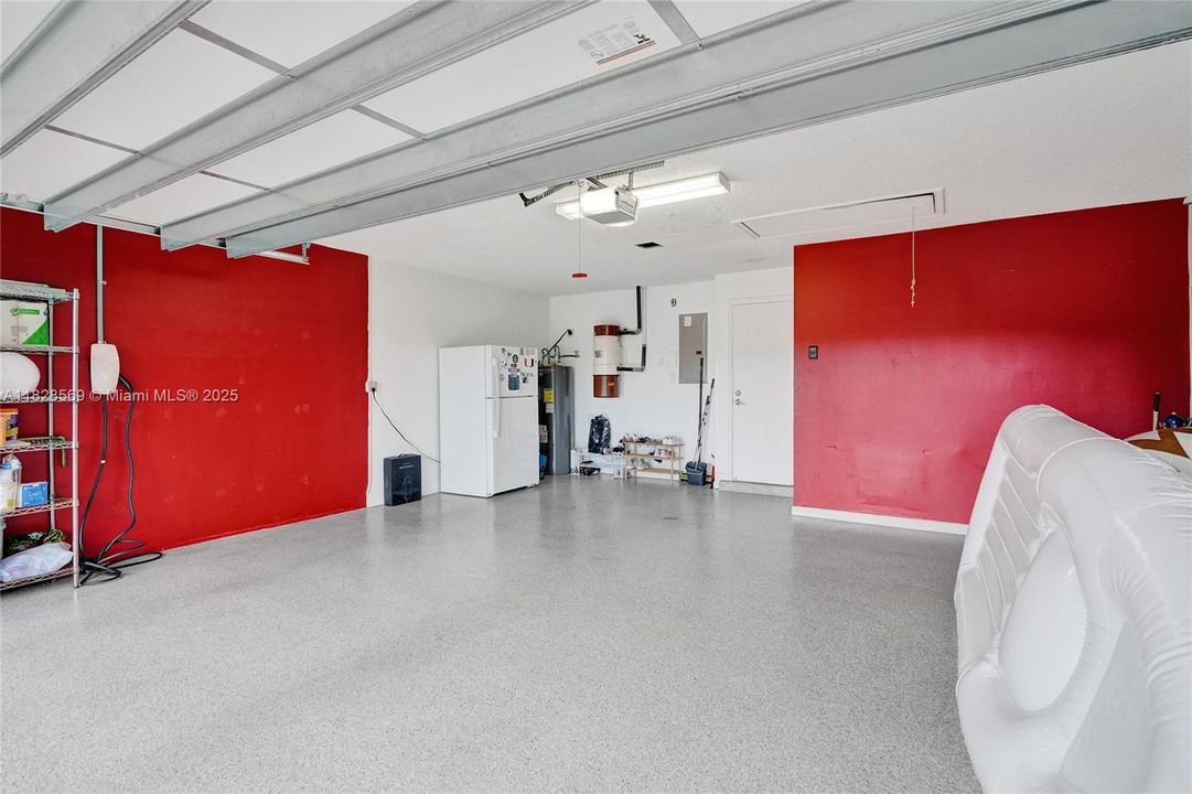 Immaculate clean and bright 2 car garage with Testla Charger