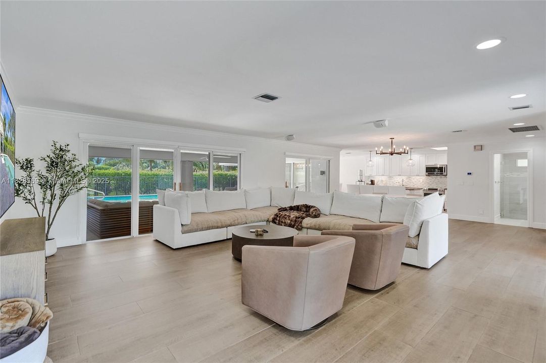 New tile flooring installed and the formerly sunken living room raised, creating a seamless, single-level layout that gives the home an elegant and timeless feel.